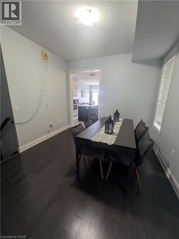 Ancaster apartment for rent - A living room with a green couch and a coffee table.