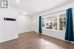 Hamilton (Stipley) apartment for rent - A room with a window and a door, with a sign that says "REALTOR".