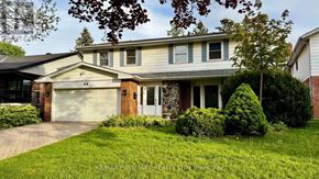 Toronto (L'amoreaux) apartment for rent - A house with a white garage door and a brick wall.