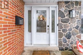 Toronto (L'amoreaux) apartment for rent - A white door with a glass window and a wreath on it.