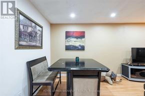 Brantford apartment for rent - A dining room with a table, chairs and a television.