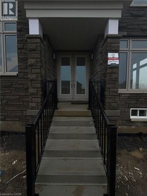 Binbrook apartment for rent - A stone building with a Realty sign on the top left.