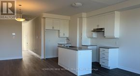 Markham (Middlefield) townhouse for rent - A kitchen with white cabinets and a sink.