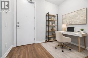 Grimsby condo for rent - A room with a desk, chair, and shelves.