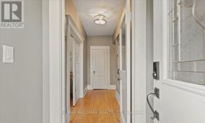 Toronto (Birchcliffe-Cliffside) apartment for rent - A hallway with a wooden floor and white walls.