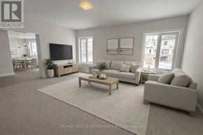 Oro-Medonte apartment for rent - A living room with a grey couch, a wooden coffee table, and a flat screen TV.
