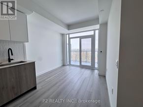 Toronto (Centennial Scarborough) condo for rent - A spacious room with a sink and wooden flooring.
