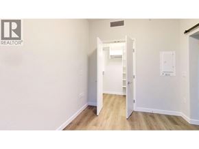 Vancouver apartment for rent - A white door is open to a hallway.