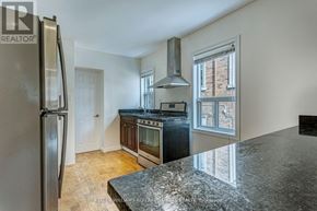 Toronto (New Toronto) apartment for rent - A kitchen with a granite counter top and stainless steel appliances.