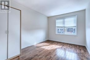 Toronto (New Toronto) apartment for rent - A room with a window and wooden flooring.