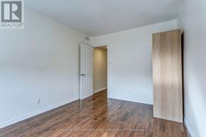 Toronto (New Toronto) apartment for rent - A room with a white door and a wooden door frame.