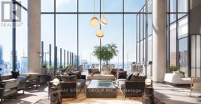 Toronto (Church-Yonge Corridor) condo for rent - A modern living room with a view of the city skyline.
