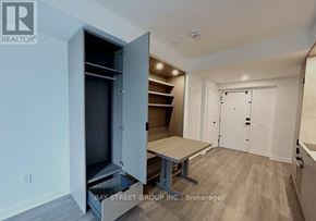 Toronto (Church-Yonge Corridor) condo for rent - A realtor photo of a room with a table and a cabinet with a drawer.