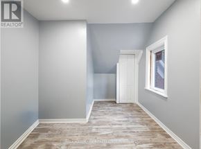 Ottawa townhouse for rent - A room with a wooden floor and white walls.