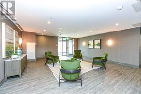 Hamilton (Waterdown) condo for rent - A spacious room with green chairs and a wooden floor.