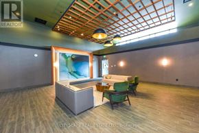 Hamilton (Waterdown) condo for rent - A room with a wooden ceiling and a white sofa.