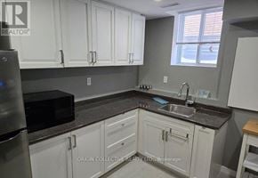 Clarington (Courtice) apartment for rent - A kitchen with Origin Collective Realty Ltd. Brokerage watermark.