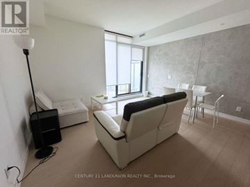 Toronto (Church-Yonge Corridor) condo for rent - A living room with a white couch and a black speaker.