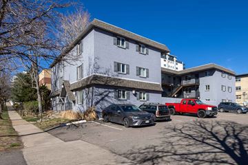 Denver apartment for rent - A grey building with a red truck parked in front.