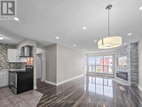 Barrie (Alliance) condo for rent - A spacious kitchen with a black countertop and a stone backsplash.