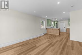 St. John's apartment for rent - A room with wooden floors and white walls.