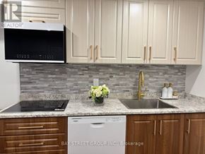 Vaughan (Vellore Village) apartment for rent - A kitchen with a microwave, dishwasher, and sink.