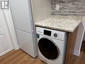 Vaughan (Vellore Village) apartment for rent - A washer and dryer in a kitchen.