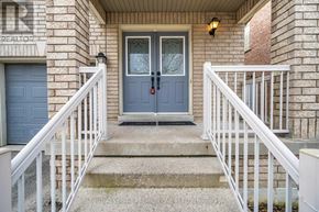 Markham (Berczy) apartment for rent - A house entrance with a blue door and white railings.