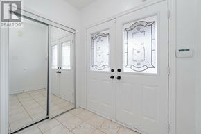 Markham (Berczy) apartment for rent - A white door with a glass panel and a handle is shown.