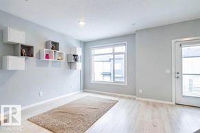 Edmonton townhouse for rent - A room with a rug on the floor and a window with blinds.