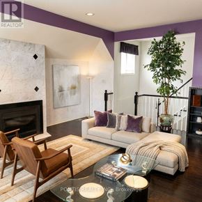 Mississauga (Central Erin Mills) apartment for rent - A living room with a fireplace and a couch.