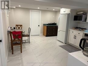 Toronto (Willowridge-Martingrove-Richview) apartment for rent - A kitchen with a table and chairs in it.
