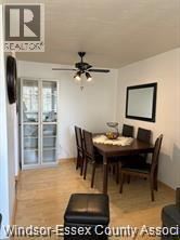 Windsor condo for rent - A dining room with a wooden table and chairs.