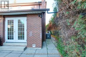 Toronto (Don Valley Village) apartment for rent - A small house with a white door and a small garden.