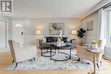 Oshawa (Mclaughlin) apartment for rent - A living room with a grey sofa and a coffee table.