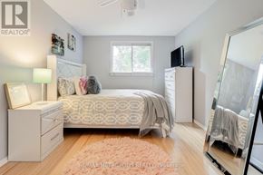 Oshawa (Mclaughlin) apartment for rent - A bedroom with a bed, dresser, and mirror.