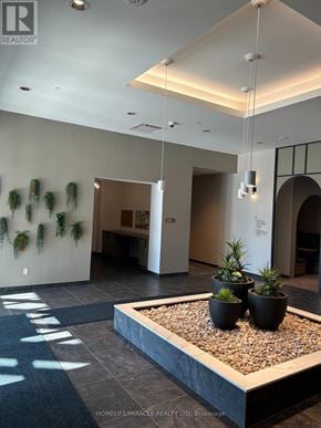 Kitchener condo for rent - A reception area with a planter box on the floor.