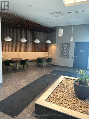 Kitchener condo for rent - A reception area with a long table and chairs.