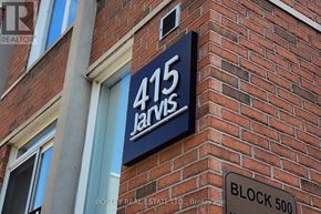 Toronto (Cabbagetown-South St. James Town) townhouse for rent - A sign for 415 Jarvis is displayed on a brick building.
