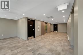 Kingsville condo for rent - A spacious room with a tiled floor and a ceiling with recessed lighting.