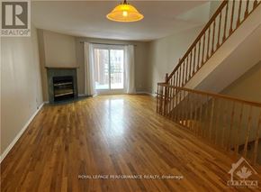 Ottawa condo for rent - A wood floor in a house with a staircase.