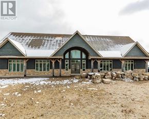 Mono apartment for rent - A large house with a stone wall in front.