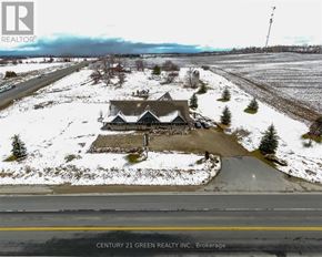 Mono apartment for rent - A house with a snowy landscape in the foreground and a road in the middle ground.