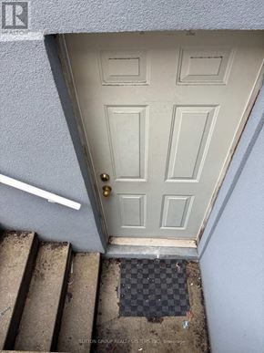 Toronto (East End-Danforth) apartment for rent - A door with a black mat in front of it.