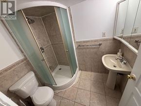 Toronto (East End-Danforth) apartment for rent - A bathroom with a toilet, sink, and shower.