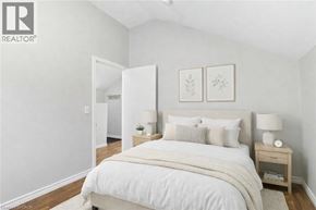 Hamilton apartment for rent - A bedroom with a large bed and two nightstands.