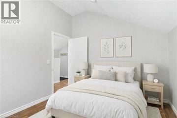Hamilton apartment for rent - A bedroom with a large bed and two nightstands.