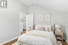 Hamilton (Strathcona) apartment for rent - A bedroom with a large bed and two nightstands.
