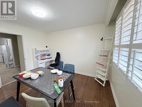 Markham (Unionville) apartment for rent - A dining area with a table set for two and a chair.