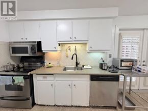 Markham (Unionville) apartment for rent - A kitchen with white cabinets and a granite countertop.